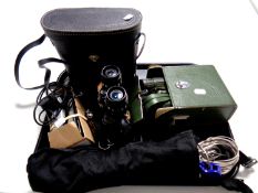 A tray containing Prinzlux zoom 14 x 35 field glasses together with two other sets of cased