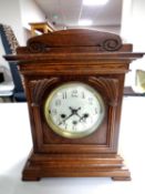 An Edwardian oak cased eight day bracket clock with silvered dial