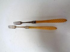 Two Birmingham silver pickle forks with resin handles