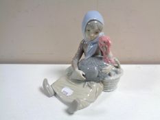 A Lladro figure of a girl with a turkey
