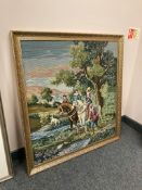 A gilt framed tapestry depicting a hunt,