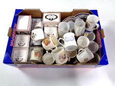 A box containing a large quantity of early 20th century boxed and unboxed commemorative mugs