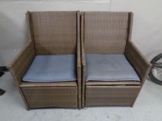 A pair of contemporary rattan armchairs