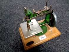 A mid 20th century Grain toy sewing machine