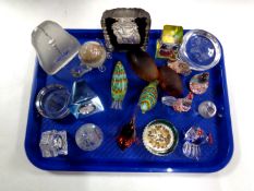 A tray containing a quantity of assorted glass paperweights and miniature desk clocks to include