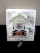 A Bradford Exchange Disney's Happiest of Times cuckoo clock with pendulum and weights