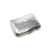 A silver cigarette case, Birmingham marks.