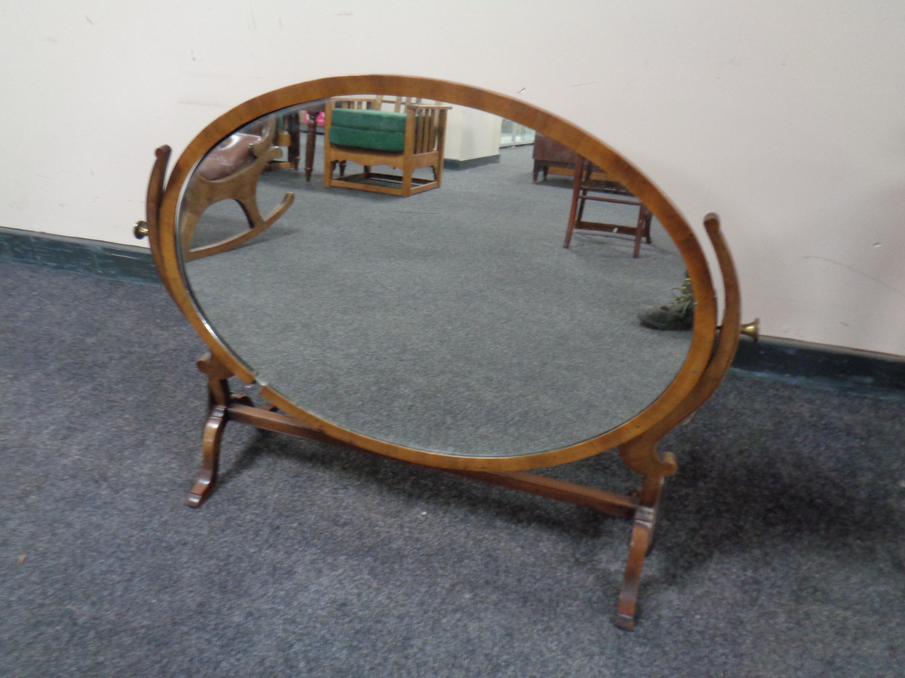 A Victorian oval dressing table mirror