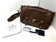 Prada : Lady's brown leather satchel with top handle and cross body strap, with makers label,