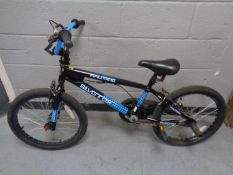 A Silver Fox half pipe BMX bike and an Apollo BMX bike