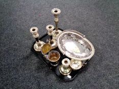 A tray containing antique and later plated wares to include candlesticks, swing handled bowl, jug,
