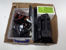 A box containing LG DVD player, electricals including headphones,