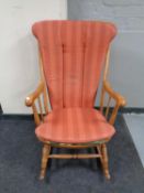 A beech spindle back rocking chair