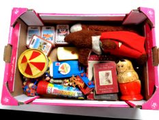 A box containing toys to include Basil Brush soft toy, Russian dolls, Walt Disney movie viewer,
