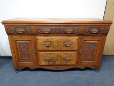 An Arts & Crafts burr walnut sideboard