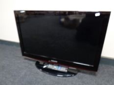 A Samsung 32'' TV with remote