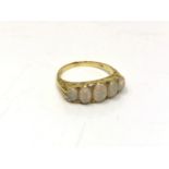 An 18ct gold five-stone opal and diamond ring, size Q. CONDITION REPORT: 5.