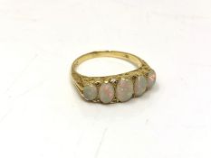 An 18ct gold five-stone opal and diamond ring, size Q. CONDITION REPORT: 5.