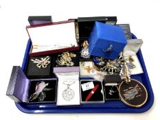 A tray of costume jewellery, compact, pens etc.