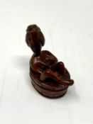 A carved hardwood Chinese netsuke - Erotic nude in wash tub