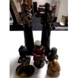 Seven African and Asian resin figures