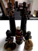 Seven African and Asian resin figures