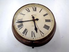 An early 20th century circular copper electric wall time piece signed Magneta