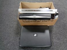 A box containing Goodman's DVD player, Sky Plus HD box,