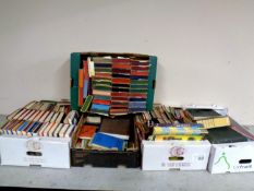 Seven boxes containing a large quantity of paperback and hardback books to include Companion book