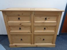 A pine six drawer chest