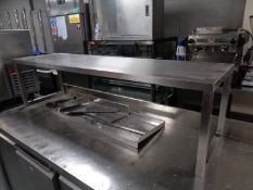 A stainless steel counter top shelf,
