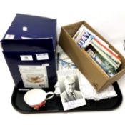 A tray containing Franz porcelain cups, embroidered table cloth, box of postcards,