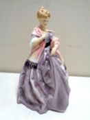 A Royal Worcester figure, First Dance, modelled by F C Doughty, No.