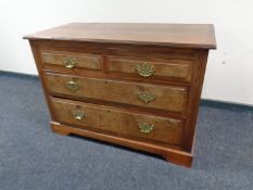 A late Victorian walnut four drawer chest