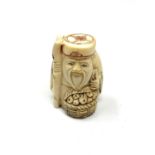 A carved bone Chinese netsuke - Village elder with food basket