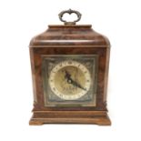 A walnut-cased mantel clock by Fattorini, height 23 cm.