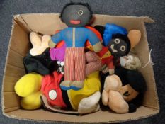 A box containing golly dolls, Disney soft toys,