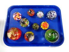 A tray containing 10 assorted glass paperweights