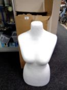 A polystyrene dress mannequin with stand
