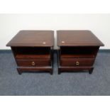 A pair of stag minstrel bedside tables fitted a drawer