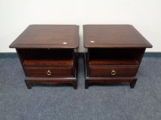 A pair of stag minstrel bedside tables fitted a drawer