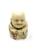 A carved bone netsuke - Happy Buddha figure