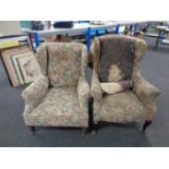 Two Edwardian wingback armchairs upholstered in a floral fabric (for reupholstery)