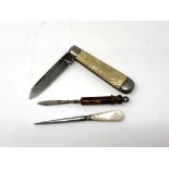 A vintage pen knife together with two small manicure items.