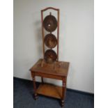 An Edwardian oak two tier occasional table together with a three tier oak cake stand