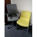 A grey fabric and mesh upholstered swivel office armchair together with a further office chair