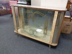 A mid 20th century melamine display cabinet