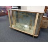 A mid 20th century melamine display cabinet