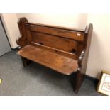 A 19th century pitch pine pew,