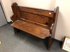 A 19th century pitch pine pew,